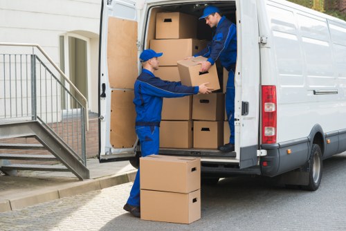 Removal team helping with a move in a Hackney street