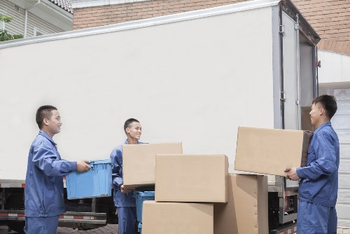 Moving van outside a Hackney apartment building with loading access