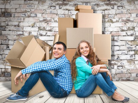 Professional movers handling household items in a Hackney property