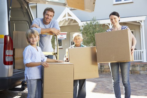 Professional movers loading items into a van in Hackney